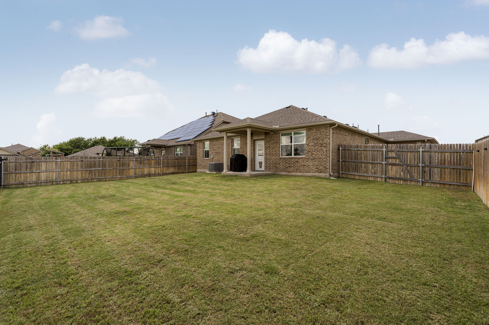 185 Struss Drive Georgetown, TX 78626 - Photo 20 of 23 A spacious backyard with a full privacy fence provides ample room for outdoor activities.
