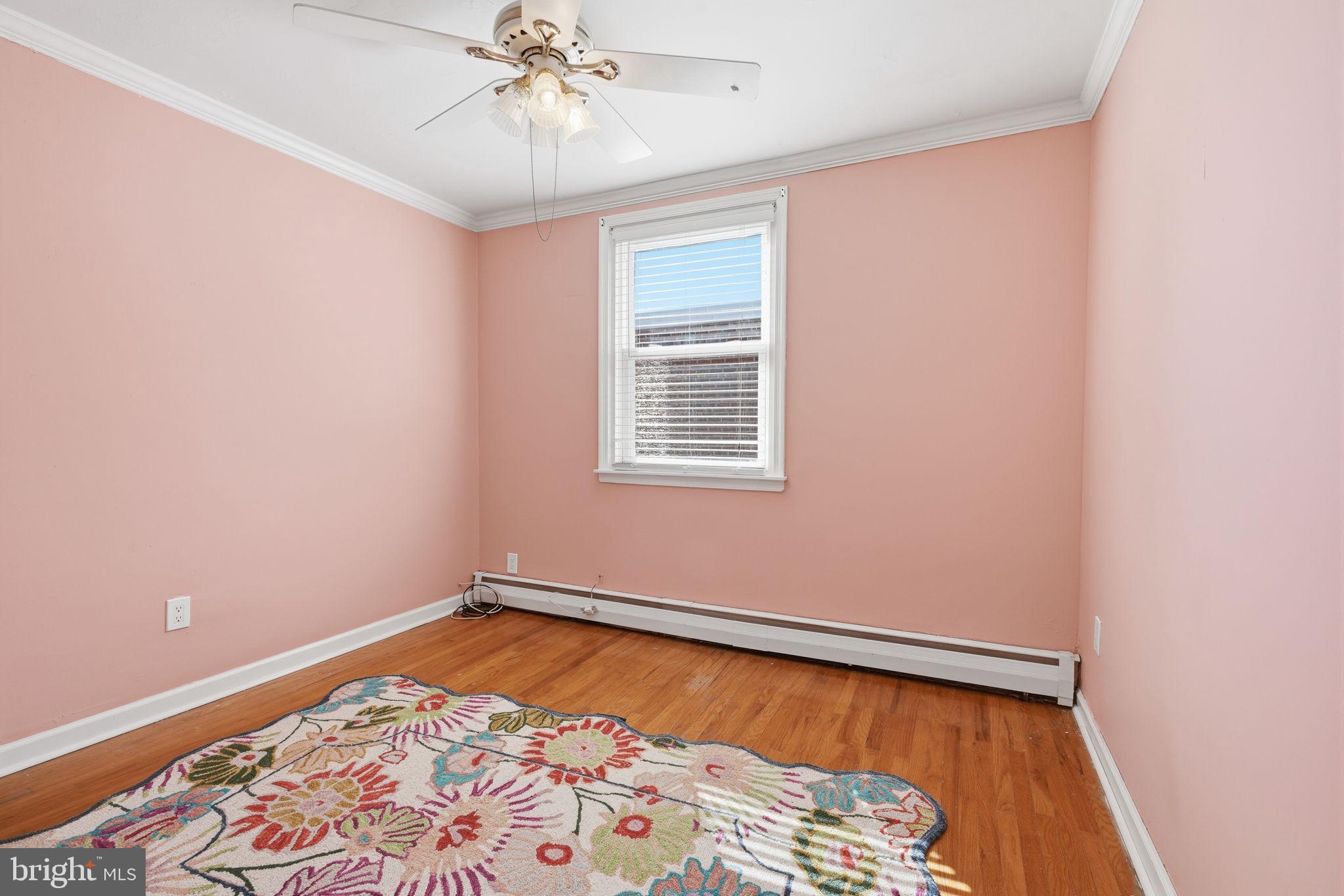1025 Friendship Street Philadelphia, PA 19111 - Photo 18 of 36 Charming pink room with natural light.