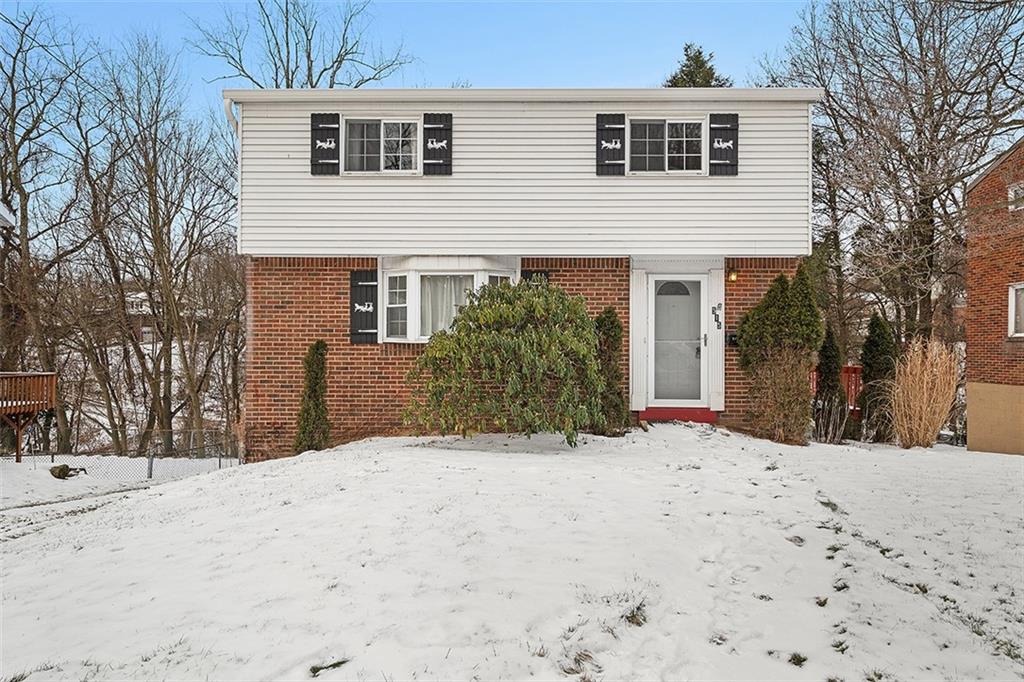 515 Braddock Road Pittsburgh, PA 15221 - Photo 1 of 38 a view of a house with a snow in the yard