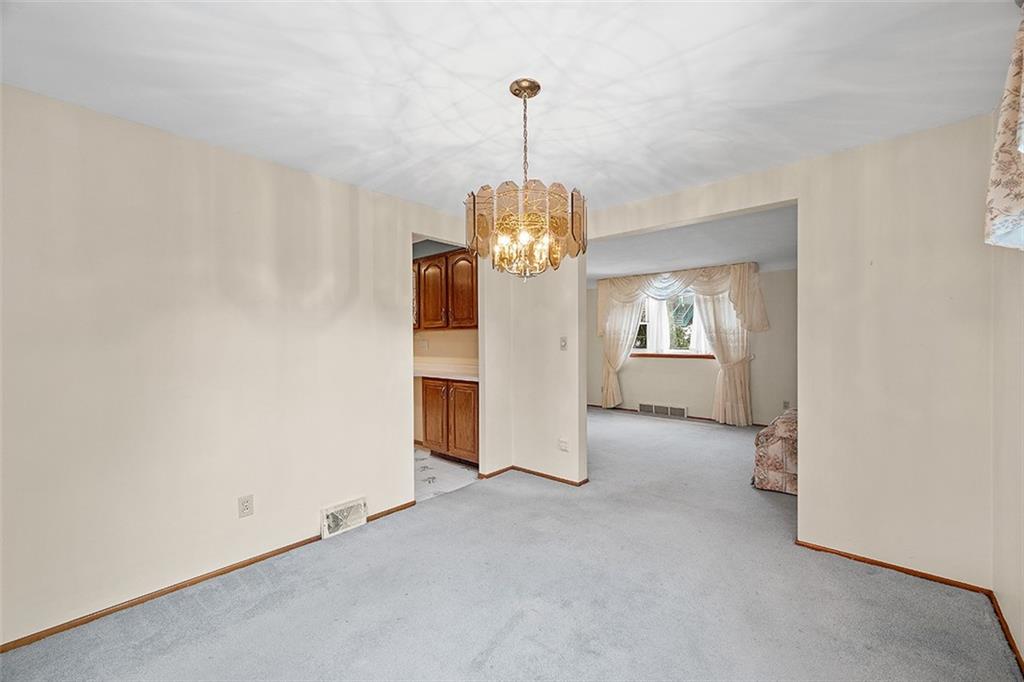 515 Braddock Road Pittsburgh, PA 15221 - Photo 11 of 38 a room with chandelier and white walls