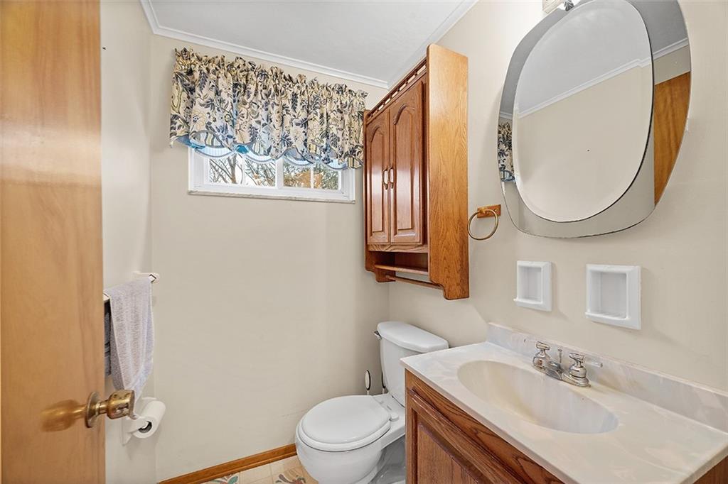 515 Braddock Road Pittsburgh, PA 15221 - Photo 16 of 38 a bathroom with a sink and a mirror