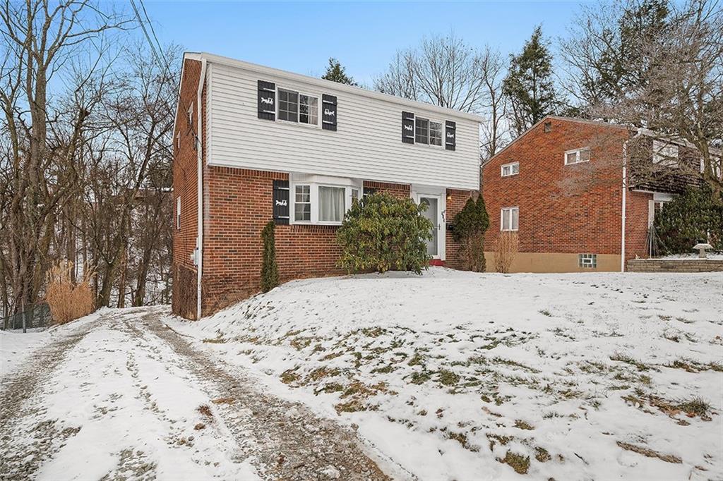 515 Braddock Road Pittsburgh, PA 15221 - Photo 2 of 38 a view of a backyard of snow on the road