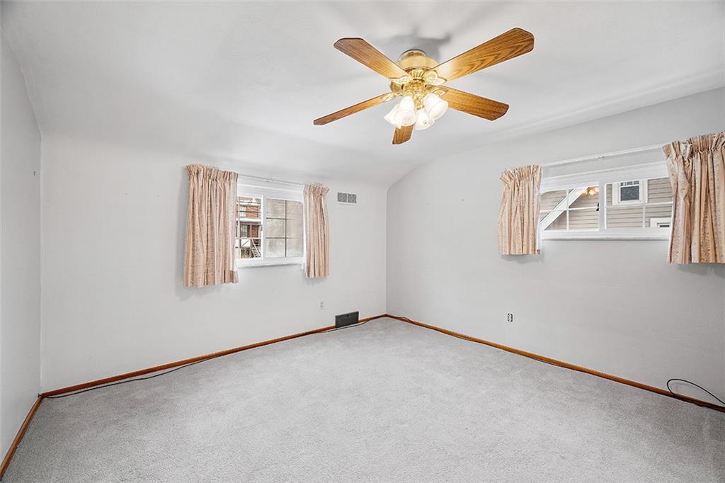 515 Braddock Road Pittsburgh, PA 15221 - Photo 25 of 38 an empty room with windows and fan