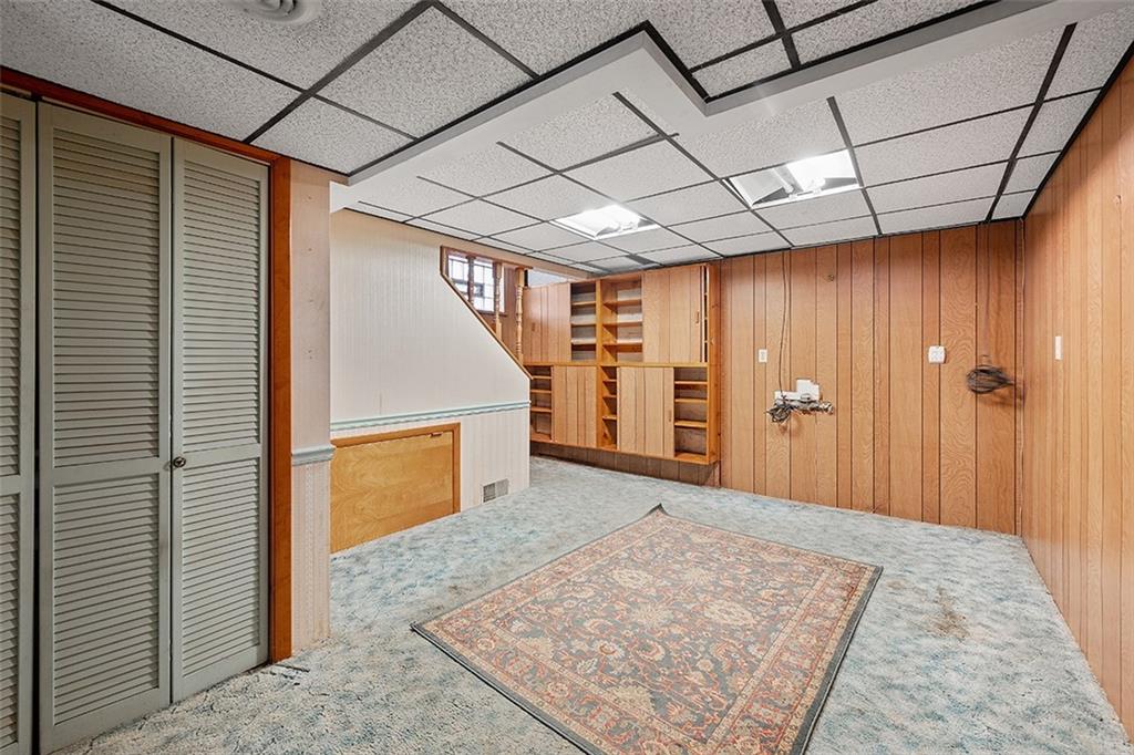 515 Braddock Road Pittsburgh, PA 15221 - Photo 30 of 38 a view of a hallway with wooden walls