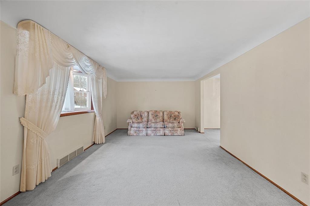 515 Braddock Road Pittsburgh, PA 15221 - Photo 6 of 38 a view of an empty room and windows