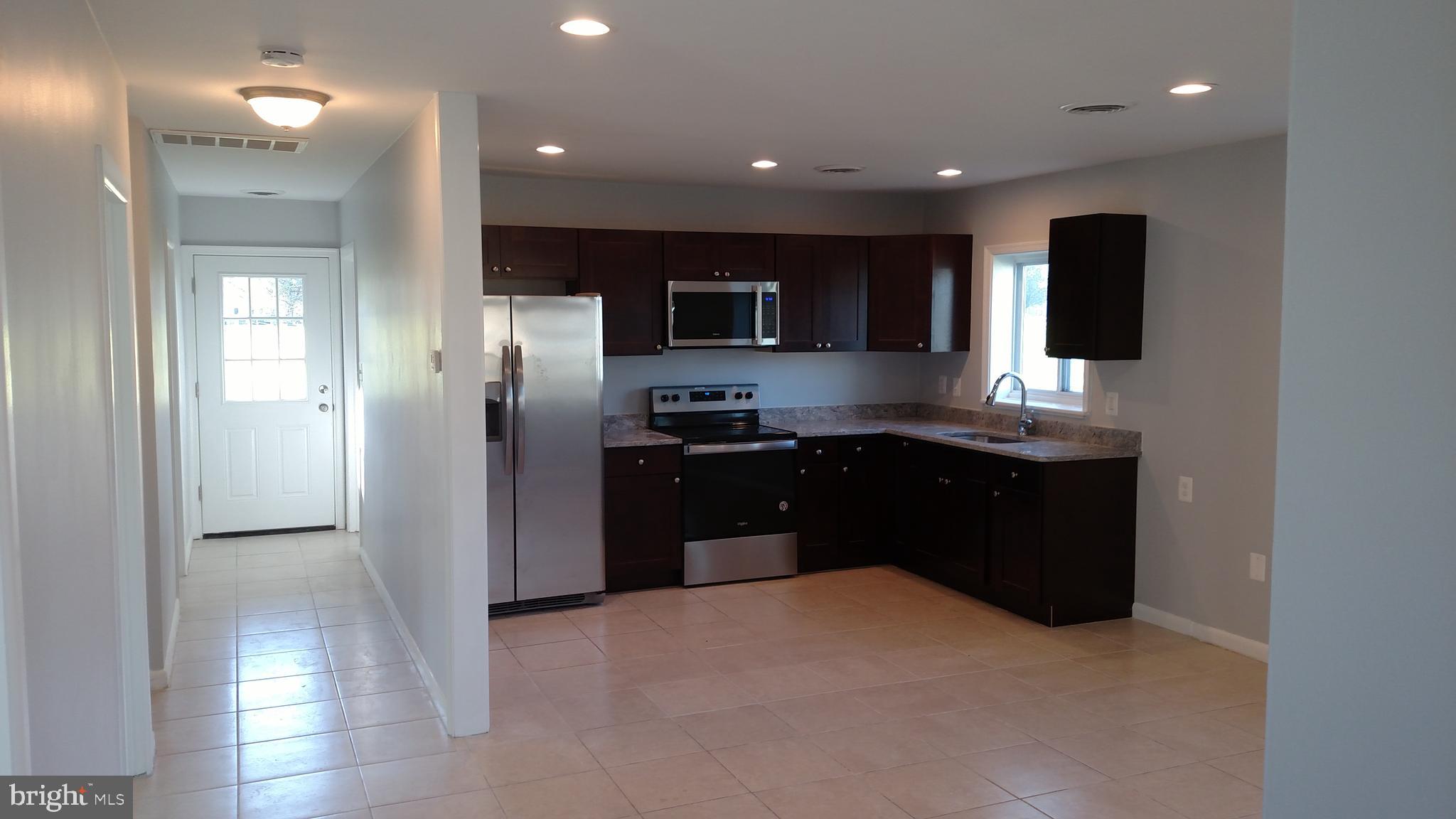 5342 Bucktown Road Cambridge, MD 21613 - Photo 3 of 33 Central hall and kitchen