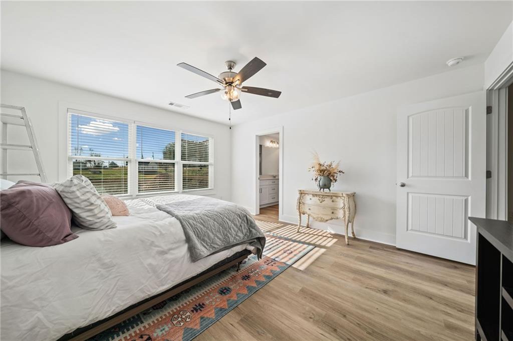 518 Old Canton Road Ball Ground, GA 30107 - Photo 16 of 42 a bedroom with a large bed and a window