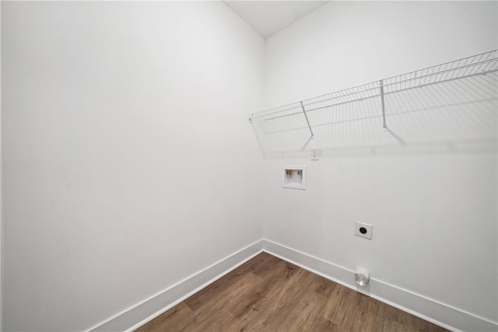 518 Old Canton Road Ball Ground, GA 30107 - Photo 24 of 42 a view of a room with racks on the wall