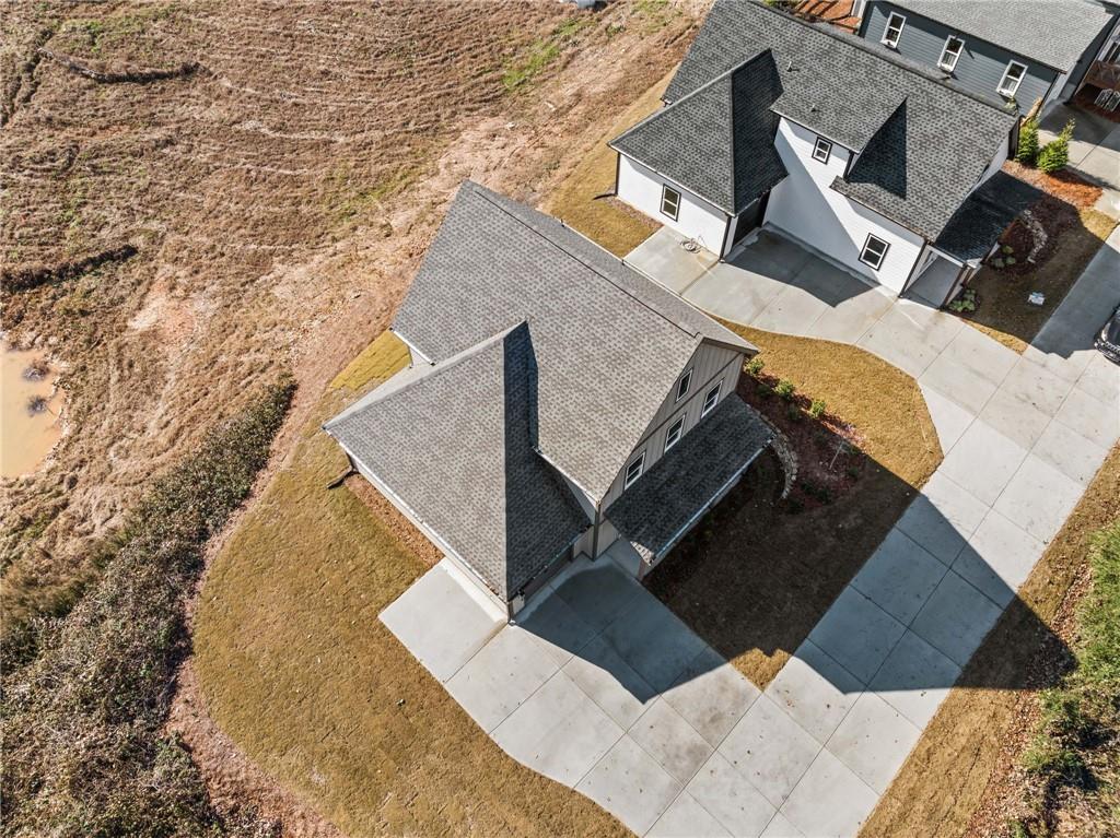 518 Old Canton Road Ball Ground, GA 30107 - Photo 4 of 42 an aerial view of a house with a backyard