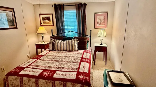 a bathroom with a sink a toilet and shower curtain