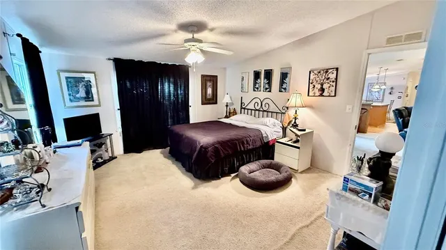 a bathroom with sink a mirror a bathtub and shower