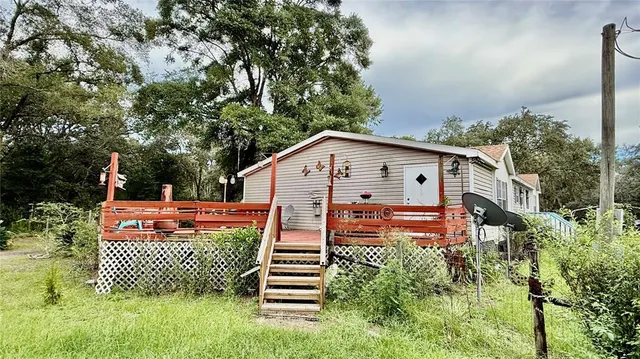 a house view with a backyard space