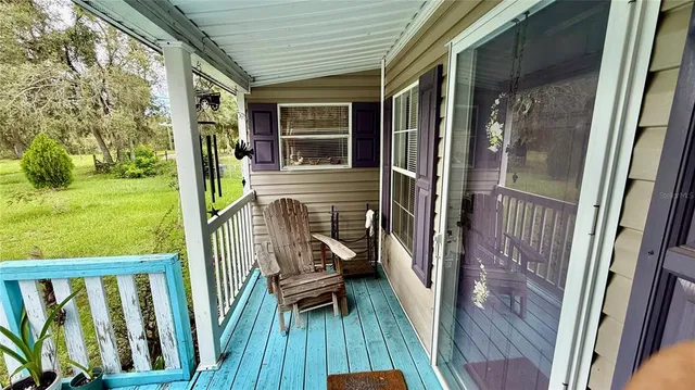 a view of a tree with a yard in back