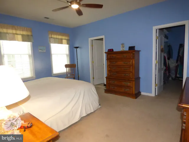 a bed room with a bed and a television