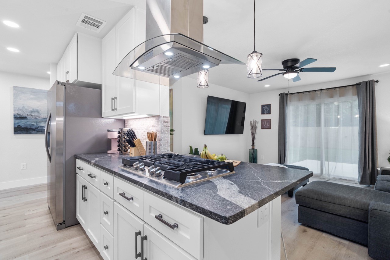 3138 Sunbeam Street Houston, TX 77051 - Photo 19 of 50 Luxury meets functionality with premium finishes, expansive prep space, and a seamless connection to the living area for true open-concept living.
