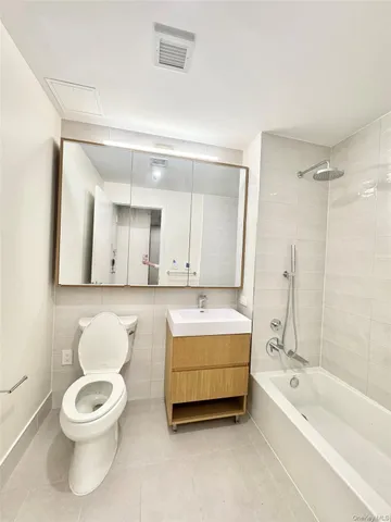a bathroom with a toilet a sink and a bathtub