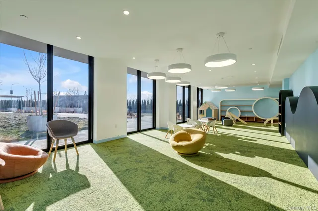 a swimming pool with view of outdoor seating