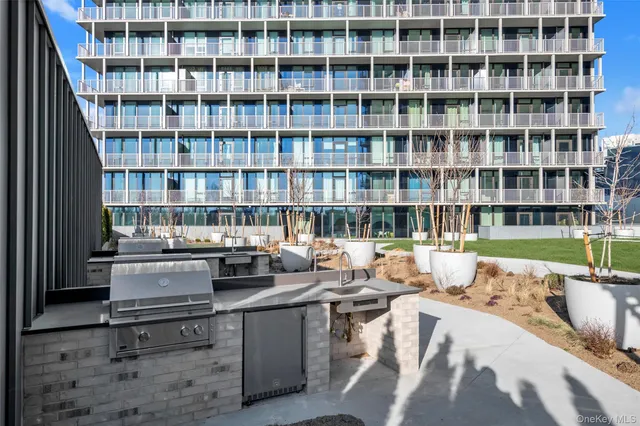a kitchen with a stove a table and chairs