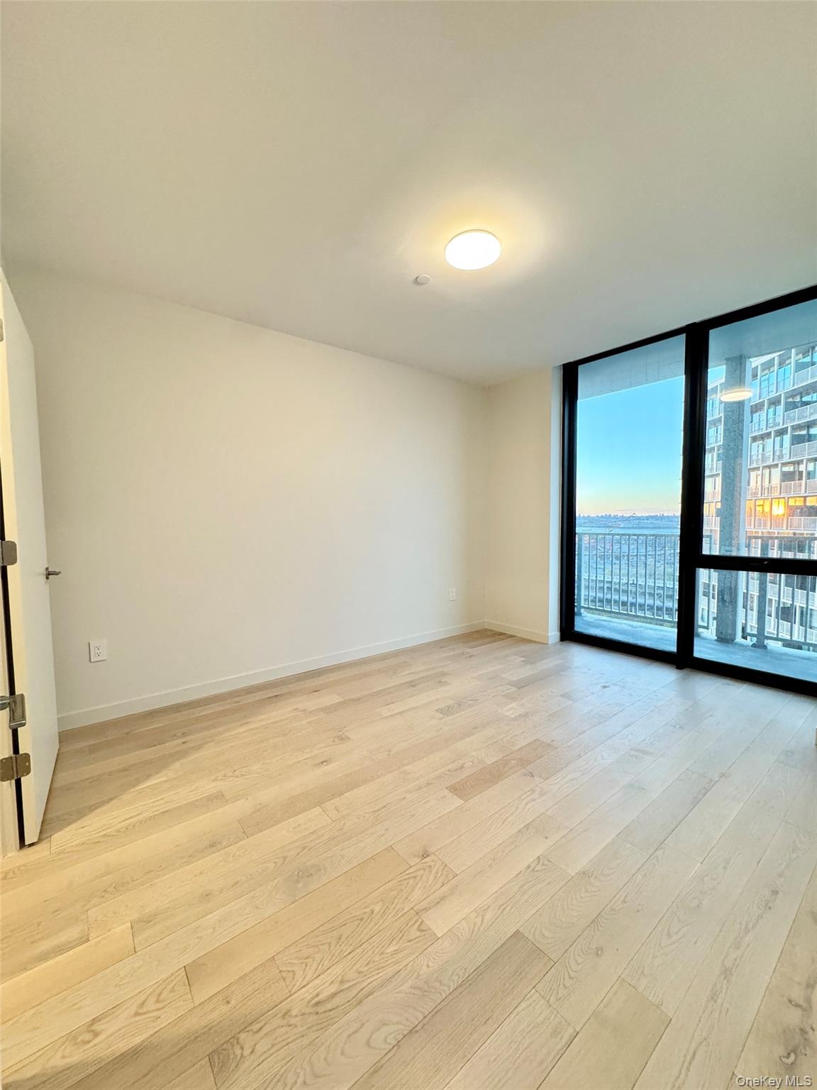 131-02 B 40th Road, Unit 16M Queens, NY 11354 - Photo 6 of 17 a view of an empty room