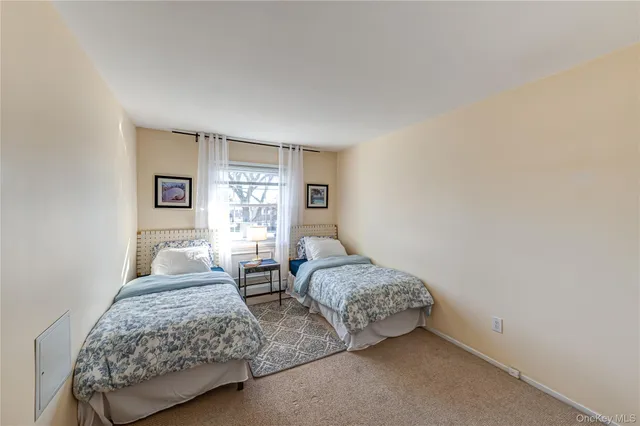 a bedroom with bed and window