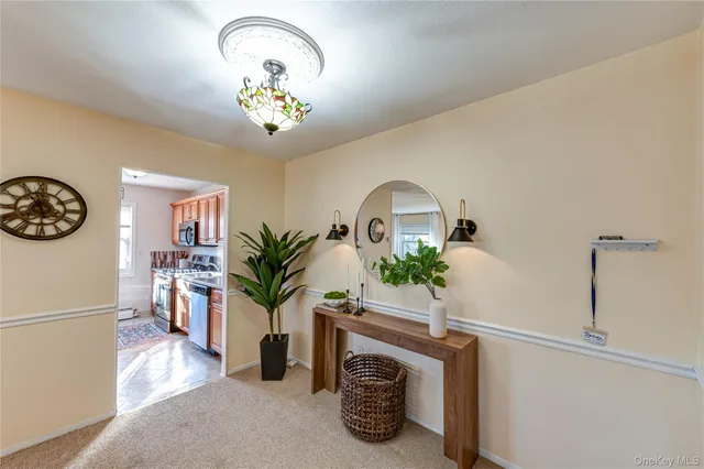 a view of living room with furniture and a chandelier