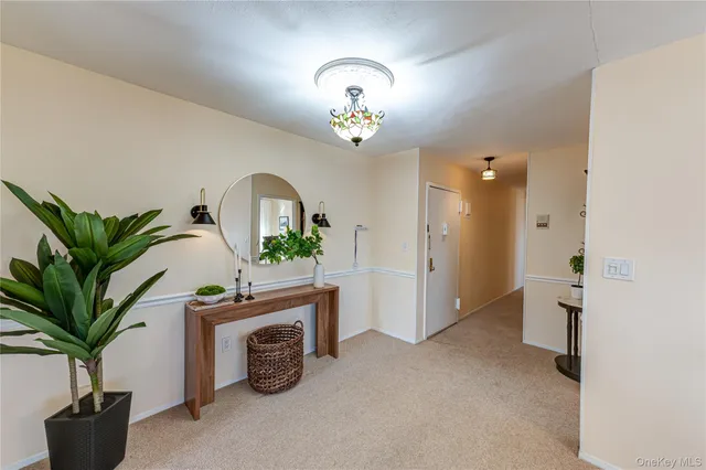 a view of entryway with kitchen