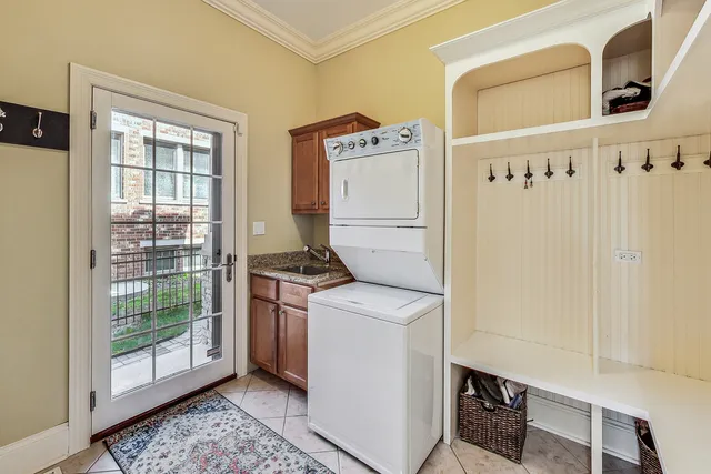 a spacious bedroom with a large bed a flat tv screen and dresser