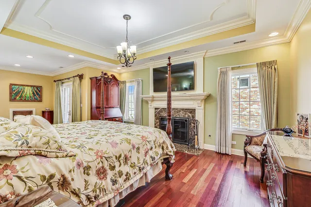 a bed room with a bed and a chandelier