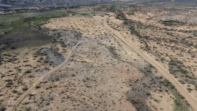 a view of a dry yard covered with snow