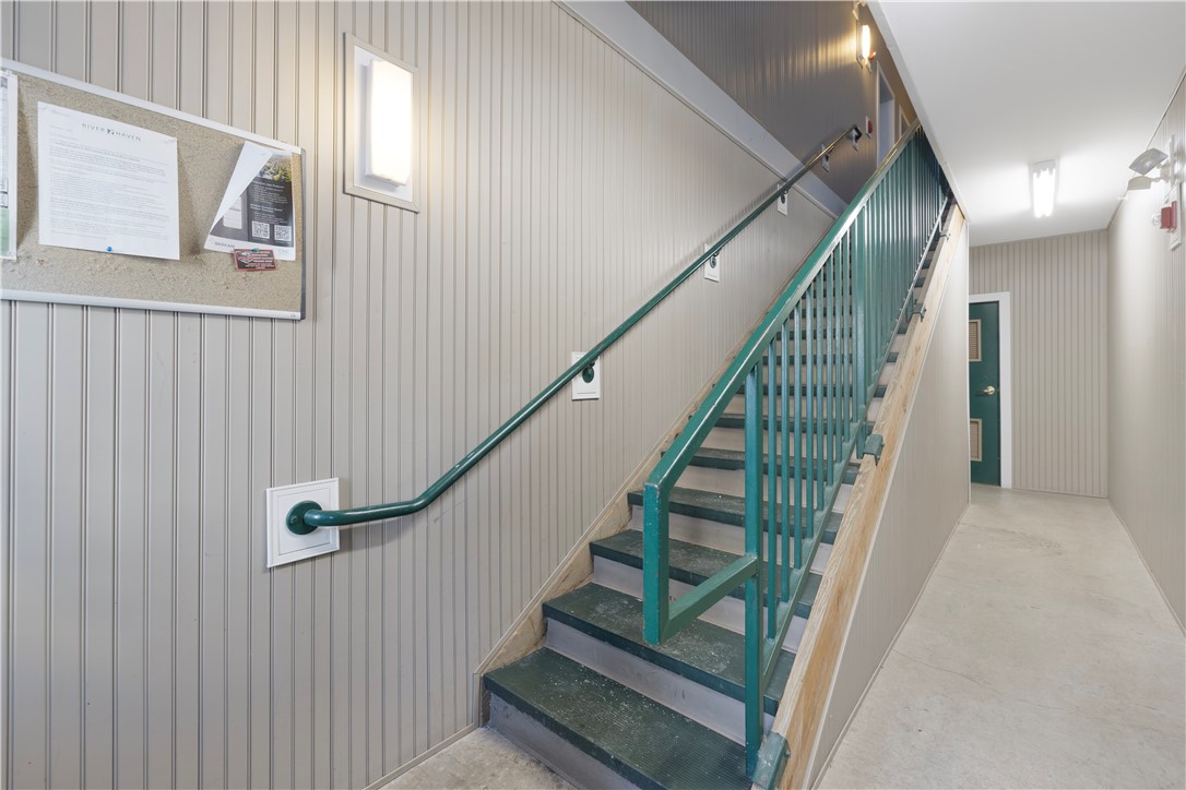 88 Mill Street, Unit 304 Woonsocket, RI 02895 - Photo 28 of 44 Stairway on main level that leads upstairs to units or to garage/storage area