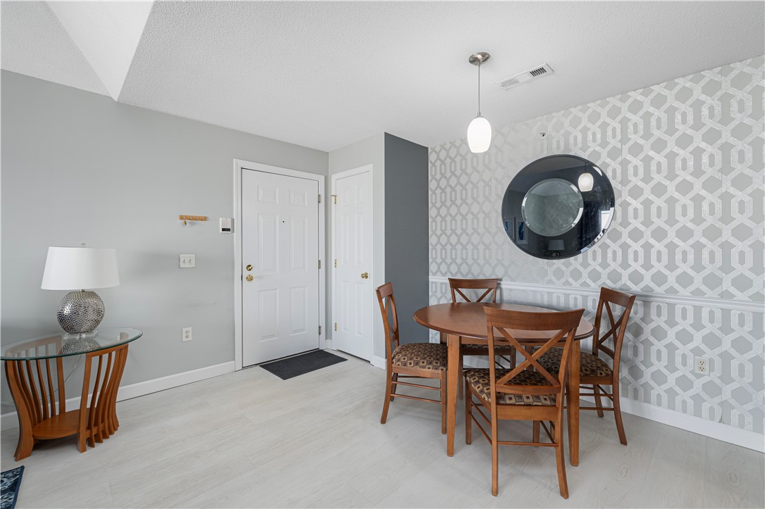 88 Mill Street, Unit 304 Woonsocket, RI 02895 - Photo 7 of 44 Entry way door on the left; coat closet on the right