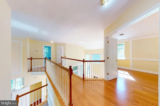 a view of a hallway with a kitchen