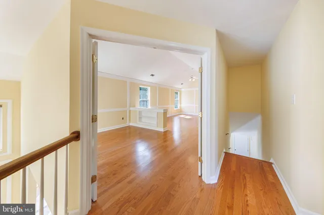 a view of an entryway with wooden floor and a window