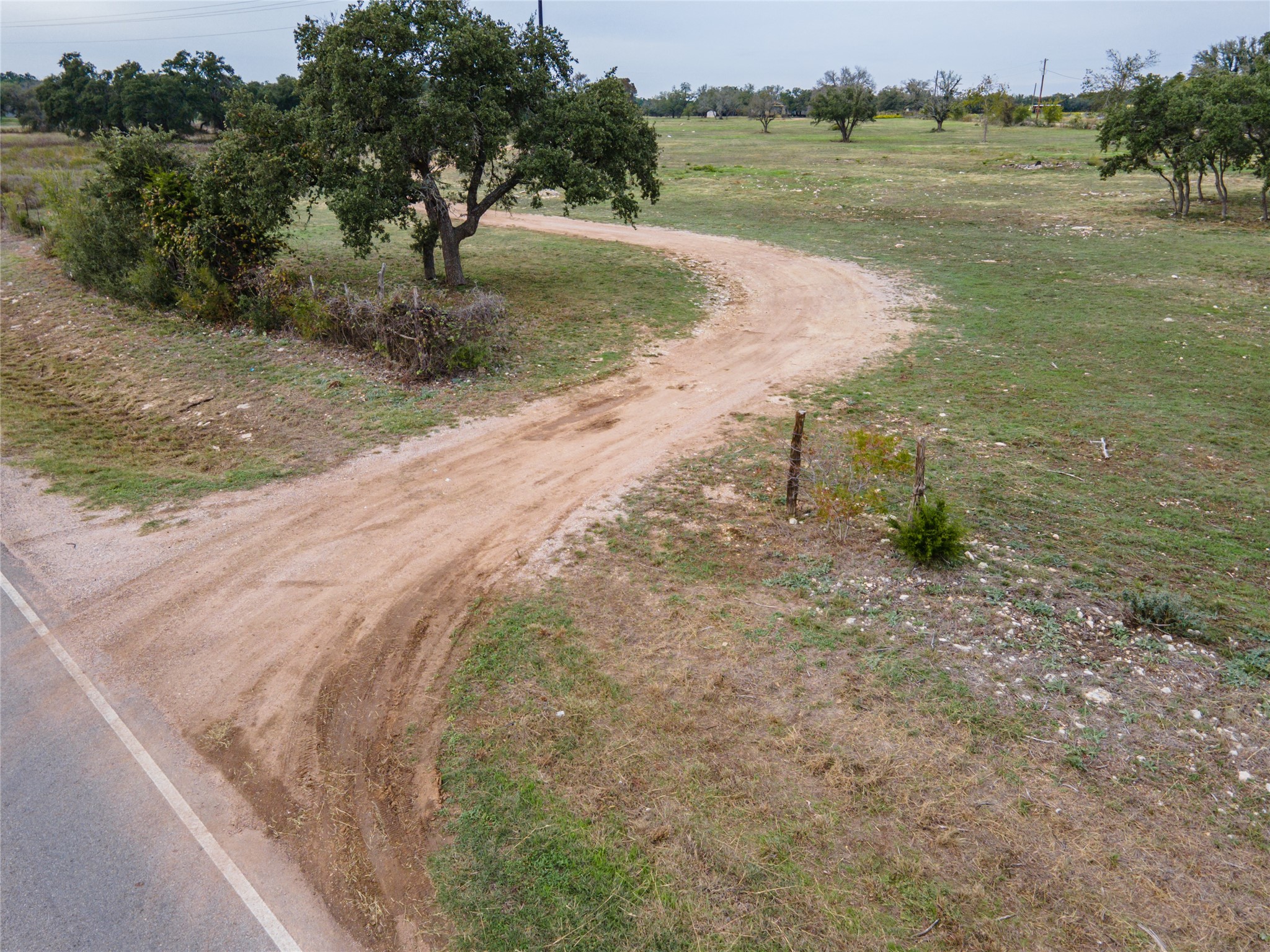 3 Ranch Road 1869 Liberty Hill, TX 78642 - Photo 11 of 15 a view of a lake with beach and green space