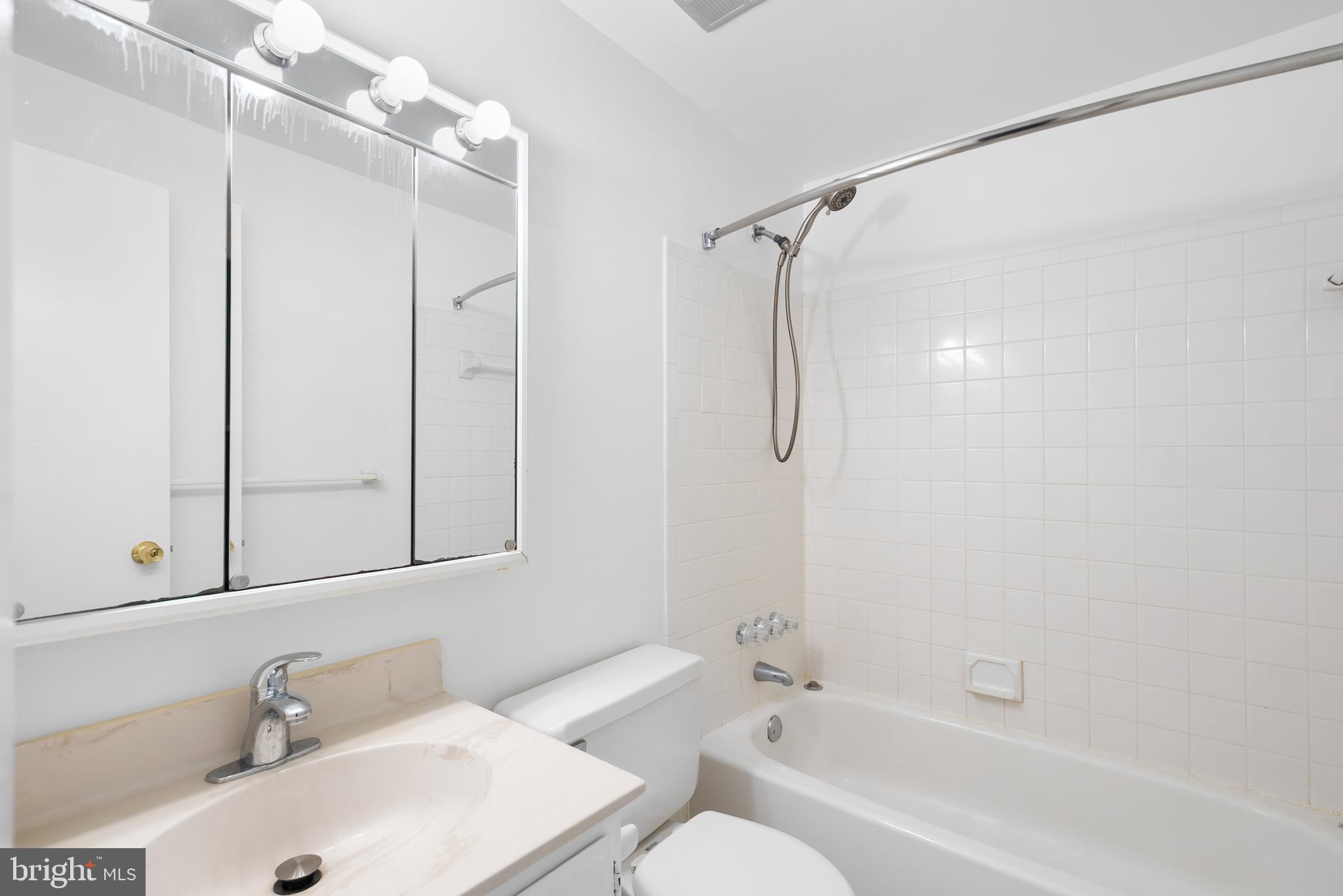 1851 Sharwood Place Crofton, MD 21114 - Photo 17 of 27 a bathroom with a sink toilet and shower