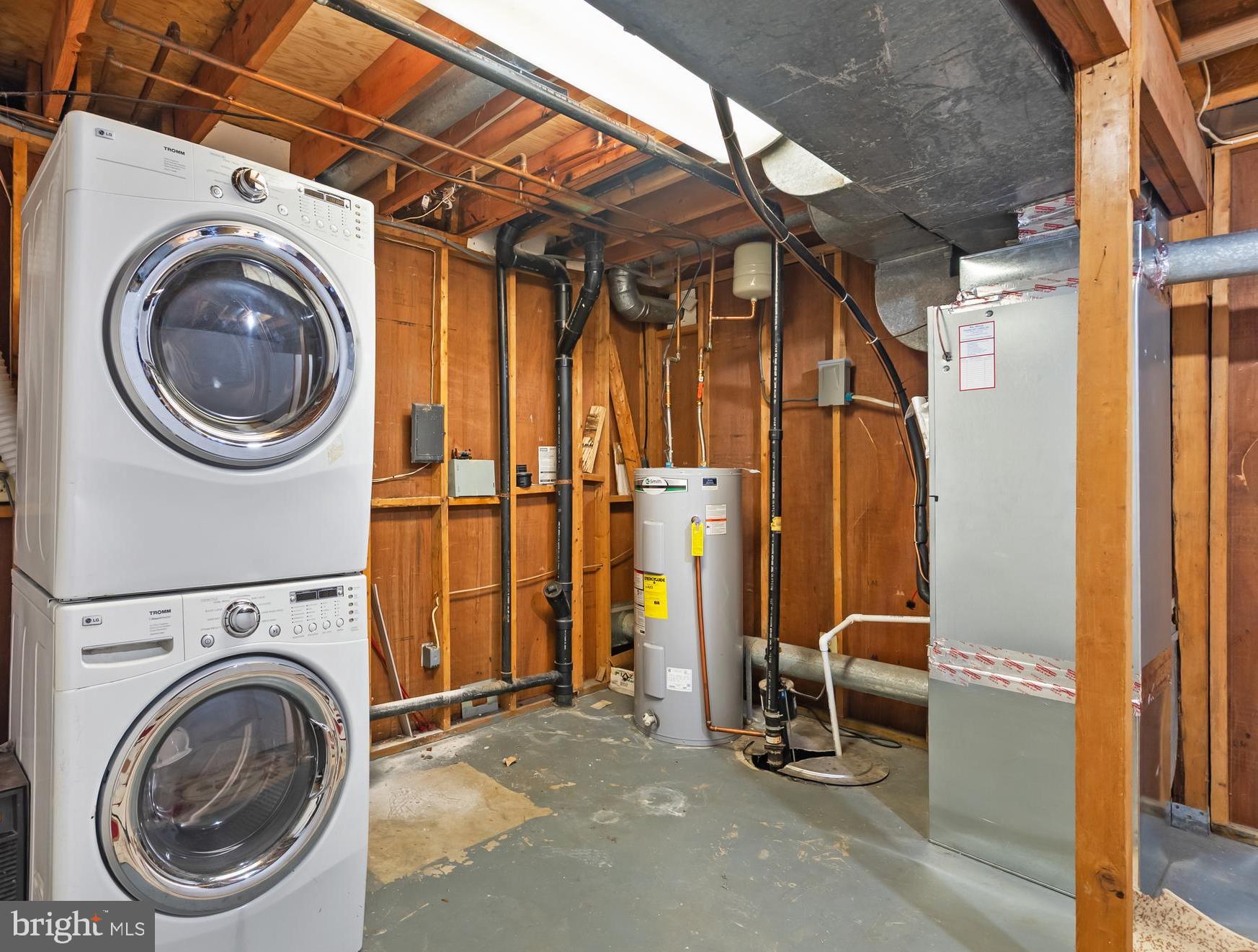 1851 Sharwood Place Crofton, MD 21114 - Photo 21 of 27 a view of a storage room with washer and dryer