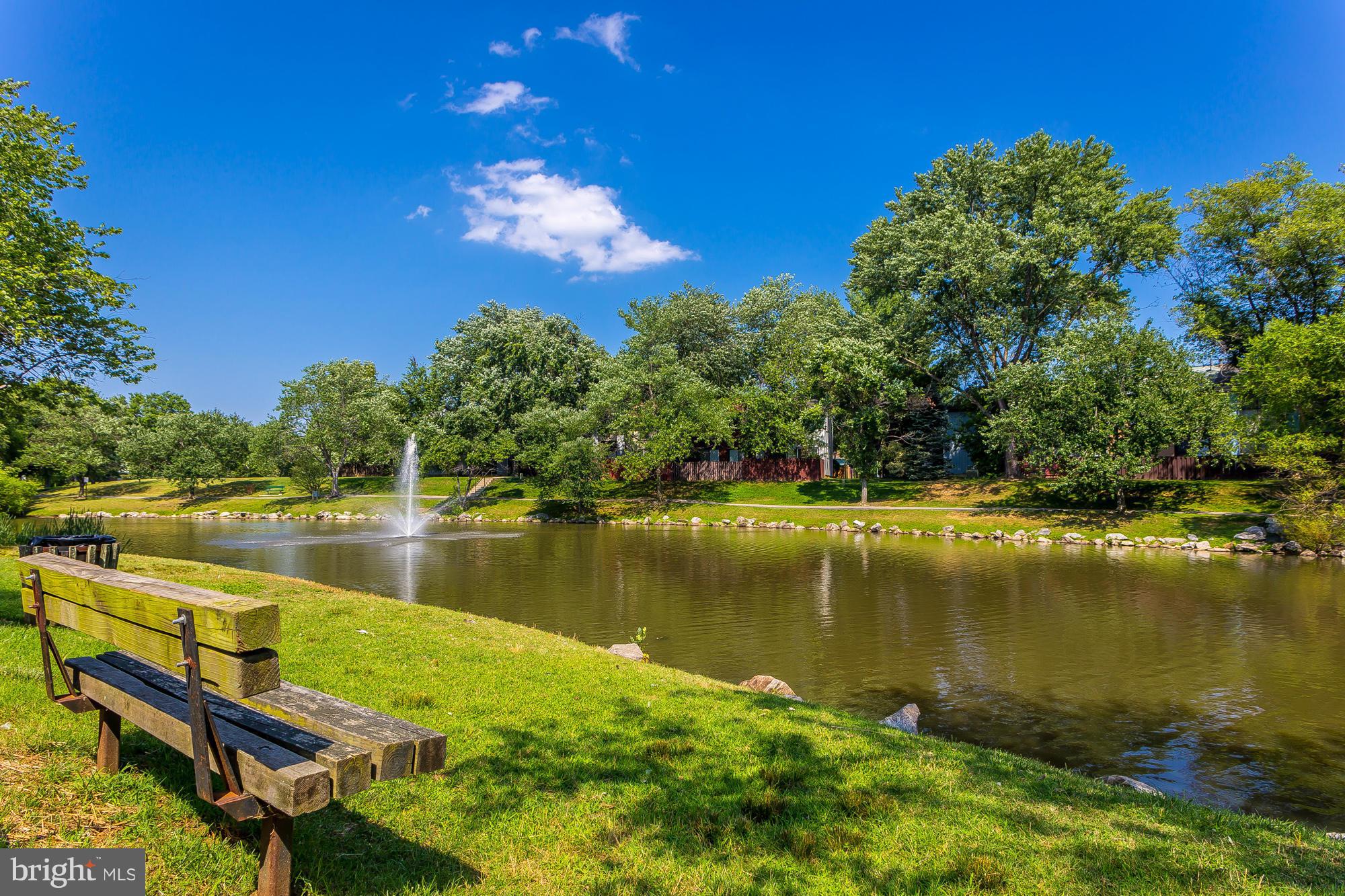1851 Sharwood Place Crofton, MD 21114 - Photo 24 of 27 a view of a lake with a table and chairs