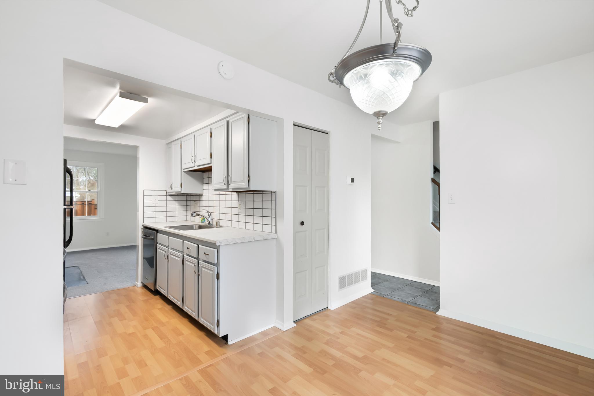 1851 Sharwood Place Crofton, MD 21114 - Photo 8 of 27 a kitchen with stainless steel appliances granite countertop a stove and a refrigerator
