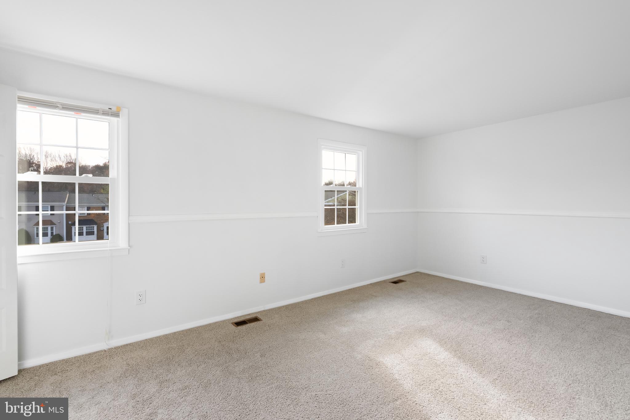 1851 Sharwood Place Crofton, MD 21114 - Photo 10 of 27 an empty room with windows
