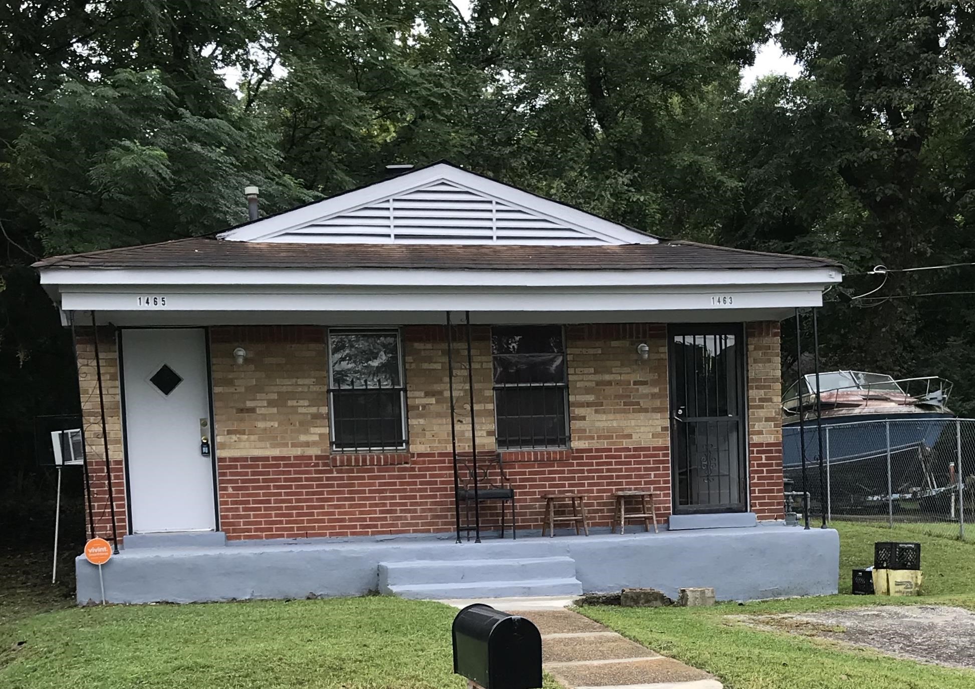 1463 Effie Road Memphis, TN 38106 - Photo 1 of 3 a front view of a house with garden