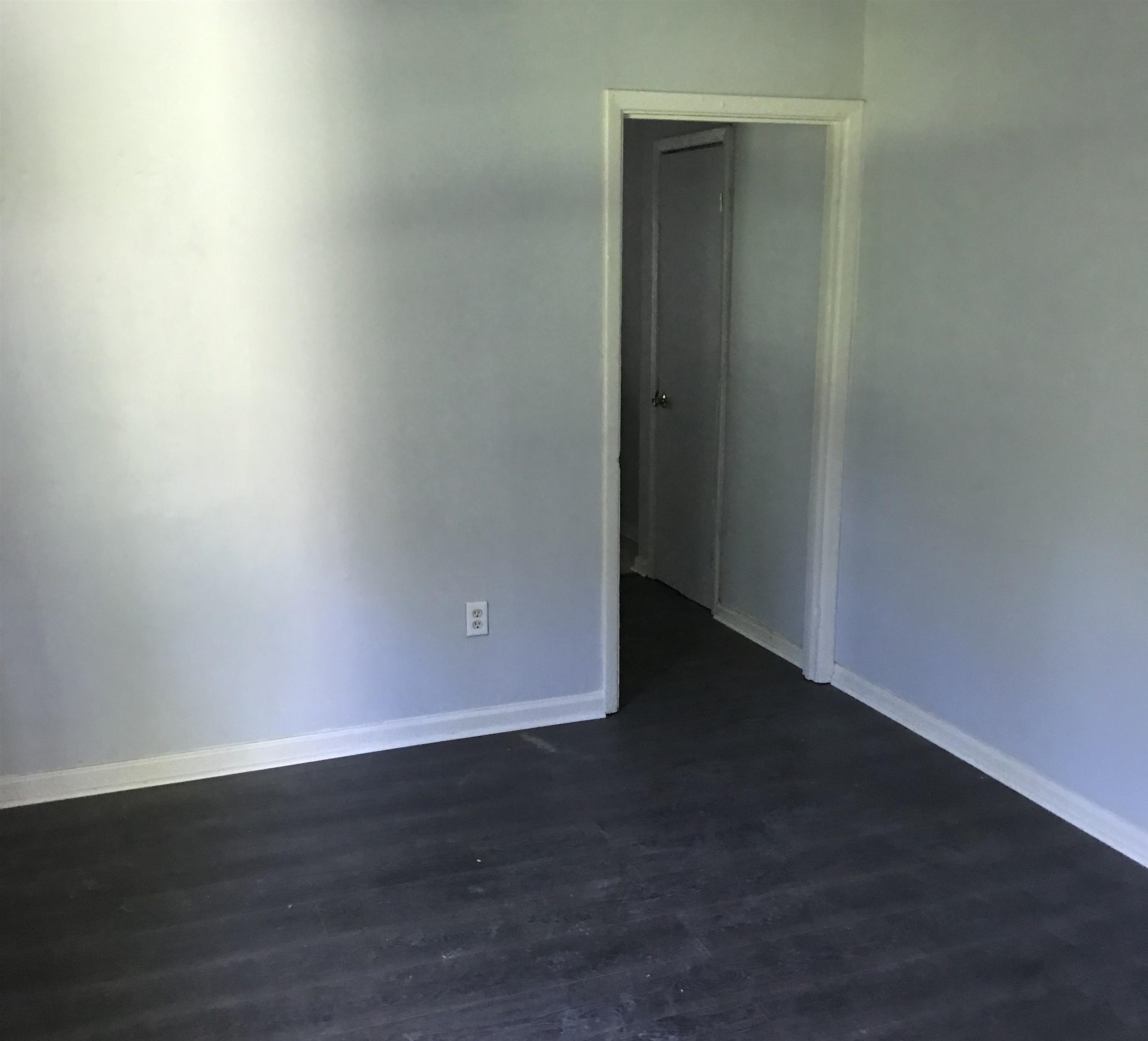 1463 Effie Road Memphis, TN 38106 - Photo 2 of 3 an empty room with wooden floor