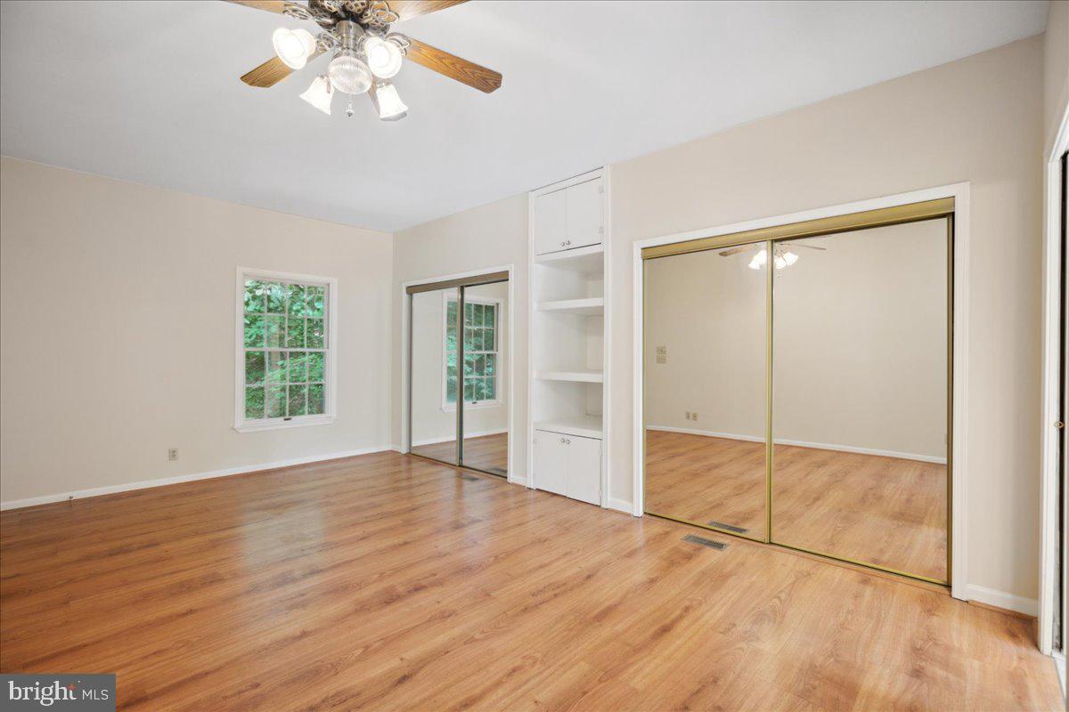 640 Willow Road Lusby, MD 20657 - Photo 45 of 67 Primary suite with dual closets and built-ins.