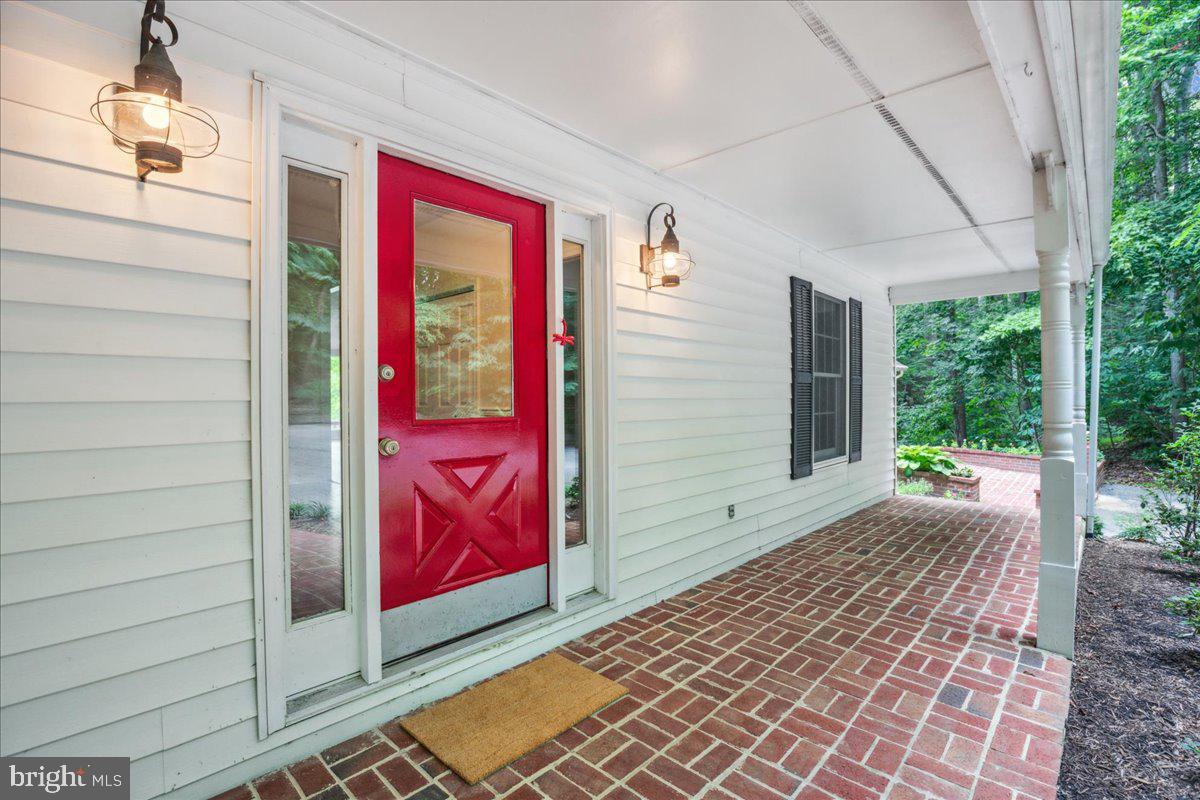 640 Willow Road Lusby, MD 20657 - Photo 6 of 67 Covered front porch with brick patio.