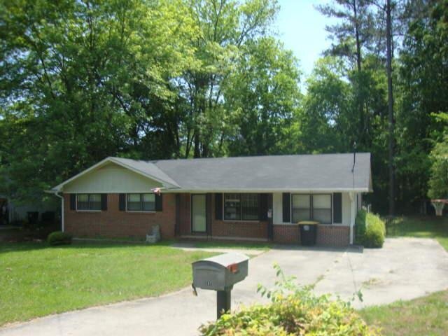 107 Lovell Lane Rome, GA 30165 - Photo 1 of 1 a front view of a house with a garden and yard