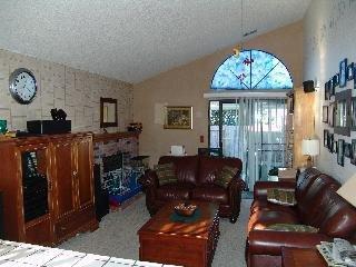 7489 Maximillian Place Rohnert Park, CA 94928 - Photo 6 of 6 a living room with furniture a fireplace and a chandelier