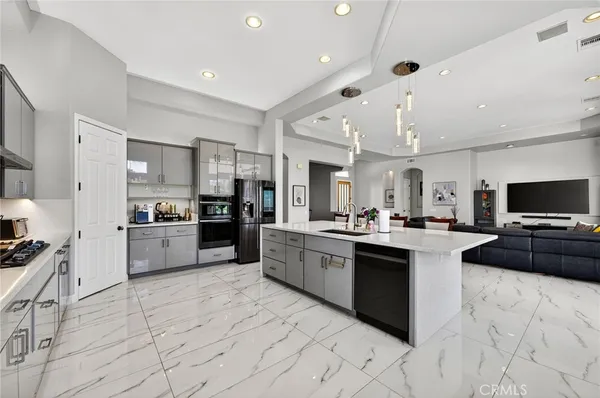 a kitchen with a sink and cabinets