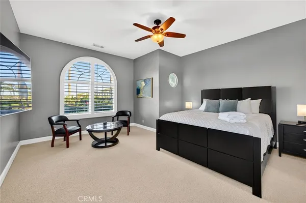 a view of a swimming pool with sitting area