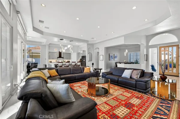 a kitchen with stainless steel appliances a stove a sink a microwave and cabinets