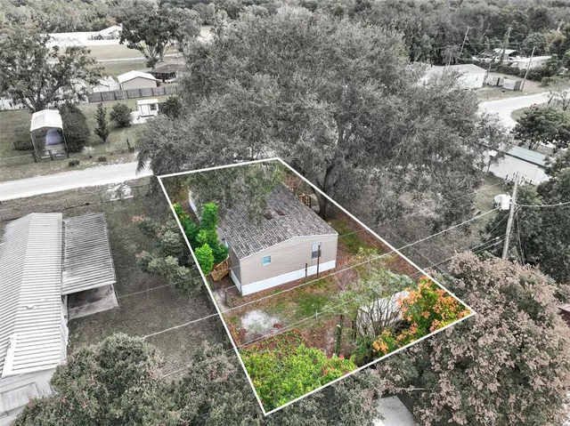 an aerial view of residential house with outdoor space