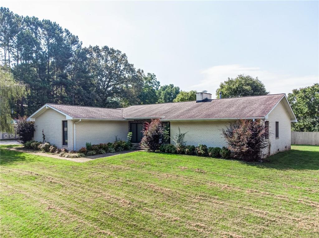 1525 Lower Bethany Road Ball Ground, GA 30107 - Photo 1 of 1 a view of a house with a yard and tree